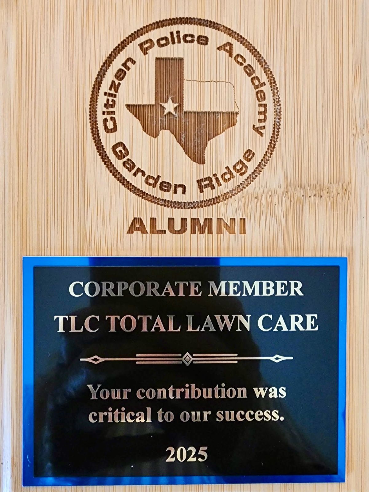 a plaque of appreciation from the Garden Ridge Citizen Police Academy Alumni Association, recognizing TLC’s corporate membership.